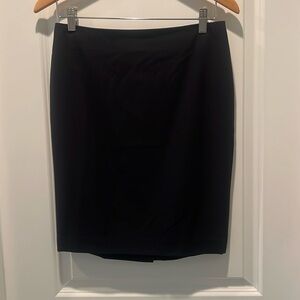 Ann Taylor black skirt, lined. Size 4p. Back zipper and slit